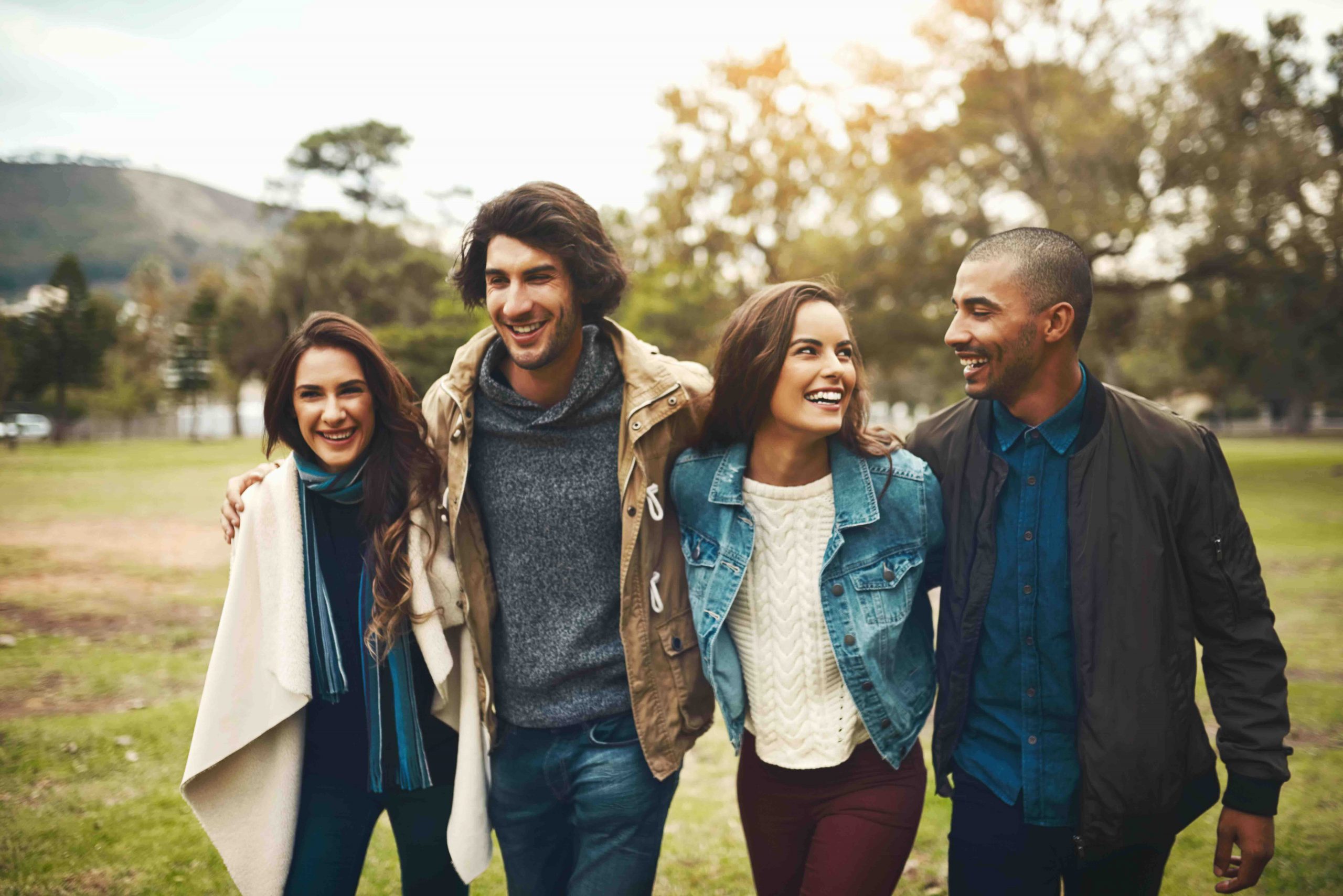Two happy couples walking together.